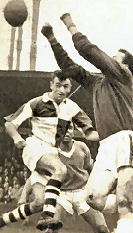 Geoff Bradford makes an aerial challenge