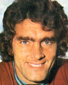 Smiling Ted McDougall poses in a West Ham kit