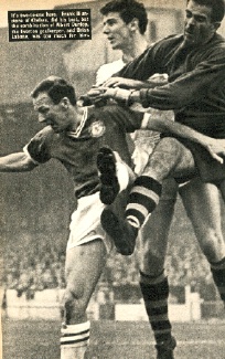 Frank Blunstone (front) challenges for the ball