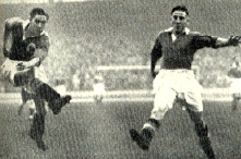 Stan Mortensen (left) fires a shot in