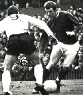 Rodney Marsh runs at a defender with the ball